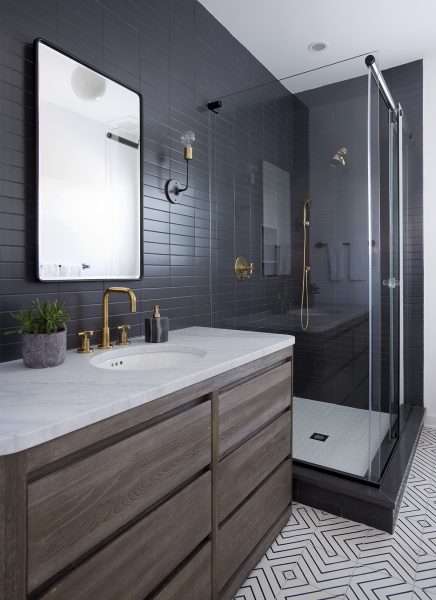 Modern Grey Subway Tile Bathroom with patterned floor tiles 