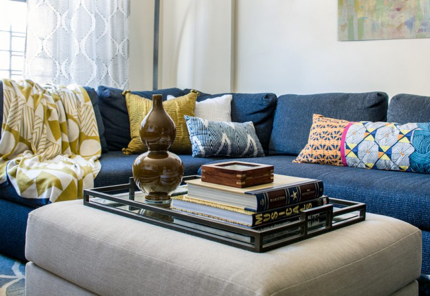 blue couch with pillows