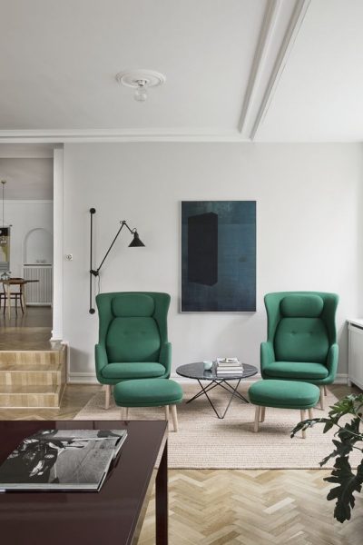 living room with green chairs 