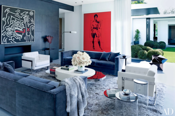 beautiful blue living room with wild red painting